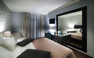 Theasis Hotel Paramythia客房内的一张或多张床位