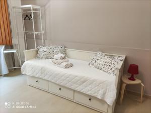 Postel nebo postele na pokoji v ubytování iMama' Rooms
