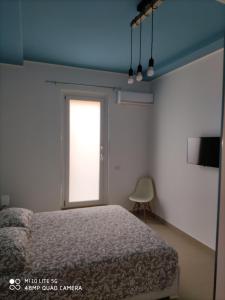 Postel nebo postele na pokoji v ubytování iMama' Rooms