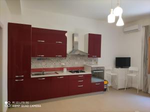 Kuchyň nebo kuchyňský kout v ubytování iMama' Rooms