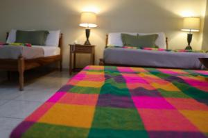 Postel nebo postele na pokoji v ubytování Hotel Ipsan Nah