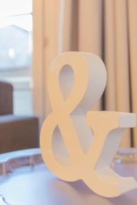 a wooden sign sitting on top of a table at Apartamentos Sierra Nevada BlueTTravel - Zona baja in Sierra Nevada