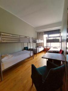 Postel nebo postele na pokoji v ubytování Arkadia Hotel & Hostel