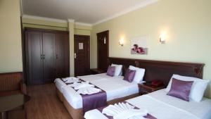 Postel nebo postele na pokoji v ubytování Marmaris Alkan Hotel