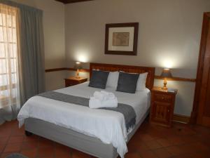Кровать или кровати в номере Oakwood Lodge