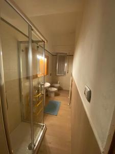 a bathroom with a shower and a toilet at Casa Diroma in Ginosa Marina