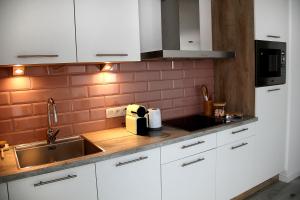 Kuchyň nebo kuchyňský kout v ubytování Appartement Blanc cocooning