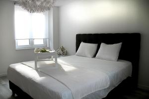 Postel nebo postele na pokoji v ubytování Appartement Blanc cocooning