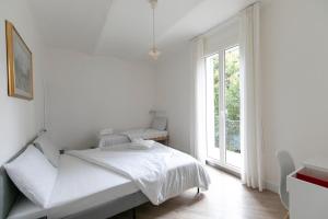 Posteľ alebo postele v izbe v ubytovaní Saragozza Apartments