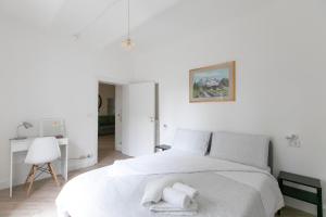 Posteľ alebo postele v izbe v ubytovaní Saragozza Apartments