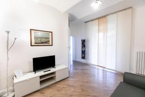 Televízia a/alebo spoločenská miestnosť v ubytovaní Saragozza Apartments
