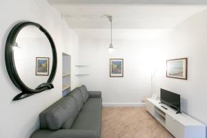 Televízia a/alebo spoločenská miestnosť v ubytovaní Saragozza Apartments