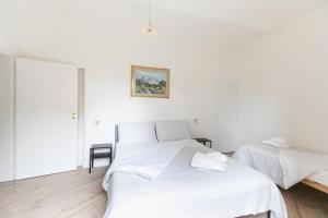 Posteľ alebo postele v izbe v ubytovaní Saragozza Apartments