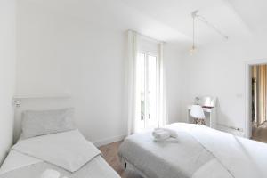 Posteľ alebo postele v izbe v ubytovaní Saragozza Apartments