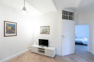 Televízia a/alebo spoločenská miestnosť v ubytovaní Saragozza Apartments