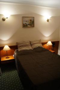 
Ein Bett oder Betten in einem Zimmer der Unterkunft Hotel de l' Esplanade
