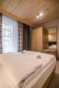 Posteľ alebo postele v izbe v ubytovaní Apartamenty u Bułecki