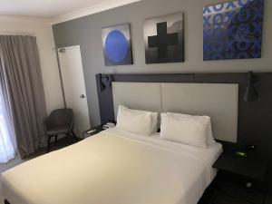 
Letto o letti in una camera di CKS Sydney Airport Hotel
