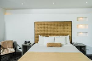 Ein Bett oder Betten in einem Zimmer der Unterkunft Riande Aeropuerto Hotel Casino