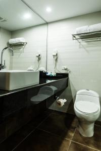 Ein Badezimmer in der Unterkunft Riande Aeropuerto Hotel Casino