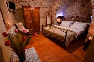 Postel nebo postele na pokoji v ubytování Robur Marsorum Albergo Diffuso + 37 fotografií