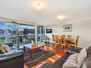 a living room with a couch and a table at Johanssons Perch 1 in Port Fairy