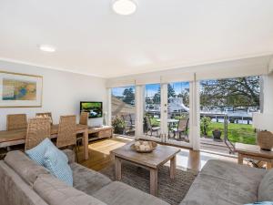 a living room with a couch and a table at Johanssons Perch 3 in Port Fairy