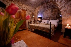 Postel nebo postele na pokoji v ubytování Robur Marsorum Albergo Diffuso
