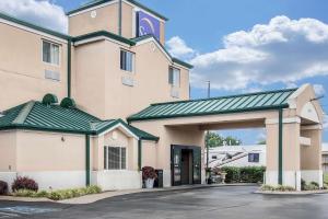 a large building with a green roof at Sleep Inn in Nashville