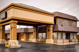 a building with a parking lot in front of it at Quality Inn & Suites Airport in El Paso