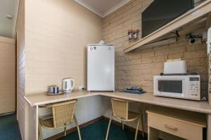 Kuchyň nebo kuchyňský kout v ubytování Allamar Motel