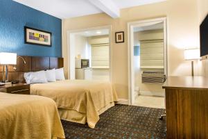 Postel nebo postele na pokoji v ubytování Quality Inn & Suites Middletown - Newport + 16 fotografií