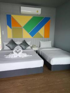 Postel nebo postele na pokoji v ubytování Raya Buri Resort Kanchanaburi