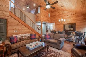 a living room with couches and a dining room at Mountain Retreat with Hot Tub & Pool Table - 1 hour from Squaw Valley Resort! in Colfax
