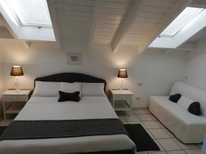 A bed or beds in a room at B&B LE MAGNOLIE