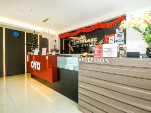 a reception area of a restaurant with a reception counter at OYO 1148 Kenyalang Suite in Miri