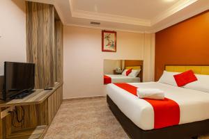 Hotel Fuji tesisinde bir odada yatak veya yataklar