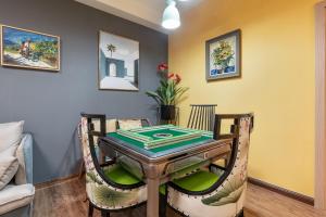 a dining room with a table and chairs at Guangzhou He She Art Apartment in Guangzhou