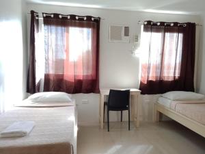 Postel nebo postele na pokoji v ubytování LOC Residence Inn