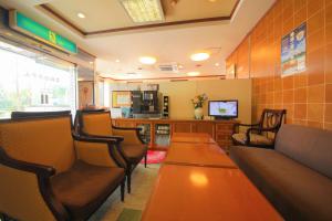 TV a/nebo společenská místnost v ubytování Heiwadai Hotel Otemon