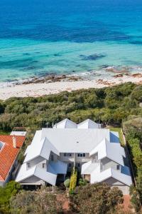 an aerial view of a white building next to a beach at WATERFRONT in Dunsborough