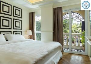 Ένα ή περισσότερα κρεβάτια σε δωμάτιο στο The LA49 Hotel