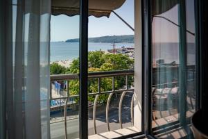 a view of the ocean from a hotel room window at Panorama Hotel - Free EV Charging Station in Varna City