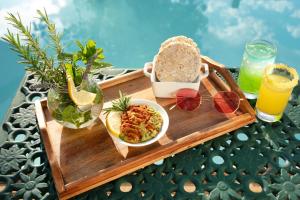 a tray with food and drinks on a table at Brooklyn Manor in Pretoria