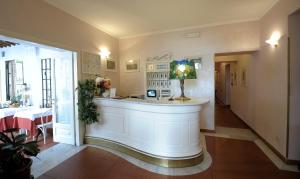a large white bathroom with a large window at Hotel Villa Belvedere in San Gimignano