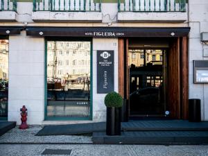 a store front of a building with a sign on it at Figueira by The Beautique Hotels & Spa in Lisbon