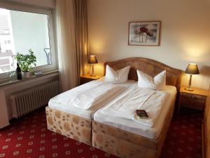 Postel nebo postele na pokoji v ubytování Apart Hotel Freiburg