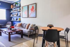 a living room with a couch and a table at SHH - Furnished 1 BHK with Balcony in Time Place Tower, Dubai Marina in Dubai