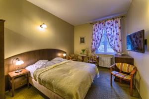 Łóżko lub łóżka w pokoju w obiekcie Hotel BERLINER
