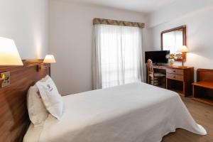 Postel nebo postele na pokoji v ubytování Hotel Comendador + 37 fotografií